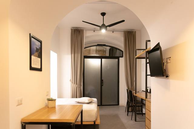 Migliara Room: the arch dividing the room and the ceiling fan